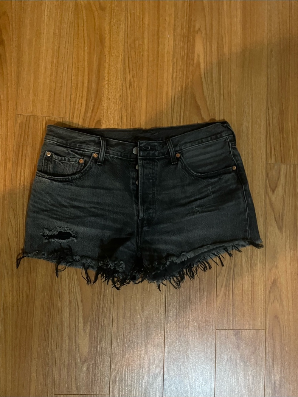 Levi’s High-Rise Black Distressed Denim Shorts